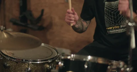 Close up energetic rock and roll tattooed drummer 4K Stock Footage 240874556