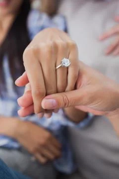 Close up of engagement ring on womans hand Stock Photos
