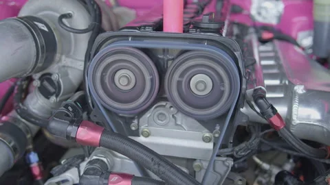 Close-up of engine cam gears and timing belt in motion Stock Footage 340610067