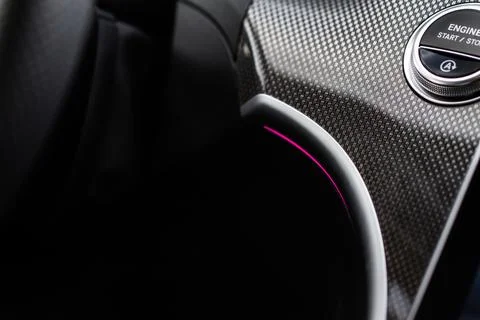 Close up engine car start stop button. Modern car black interior details. Stock Photos