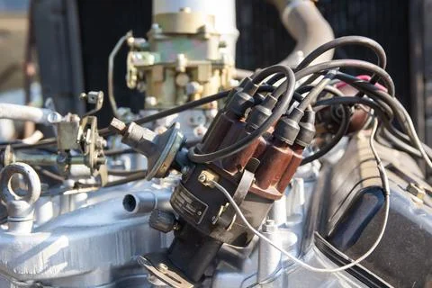 Close-up of an engine distributor with spark plug wires connected to it, pa.. Stock Photos