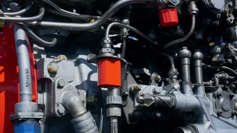 Close-up of an engine with fuel mixture and lubrication piping, engine piping 스톡 동영상 213617090