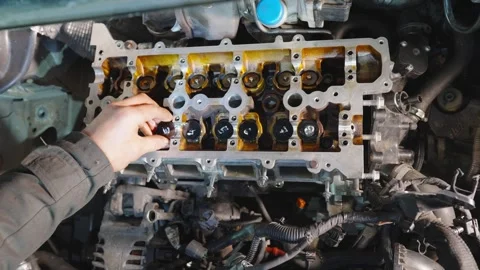 Close-up of engine repairs, parts replacement, maintenance. Workflow at car Stock Footage 325521210