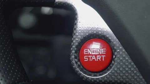 Close up of engine start button. White man's hand pushes it Stock Footage 96521525