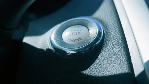 Close up of engine start stop button on car dashboard Video stock 338021330