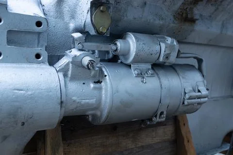 Close-up of the engine starter attached to the engine block Stock Photos