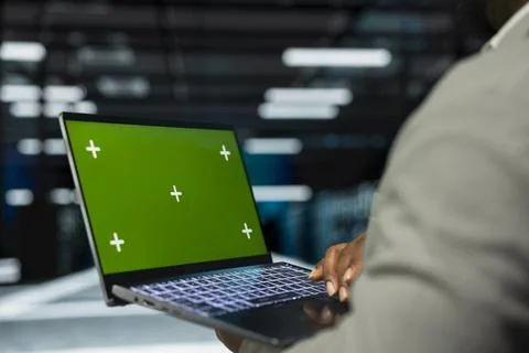 Close up of engineer in data center using isolated screen laptop Stock Photos