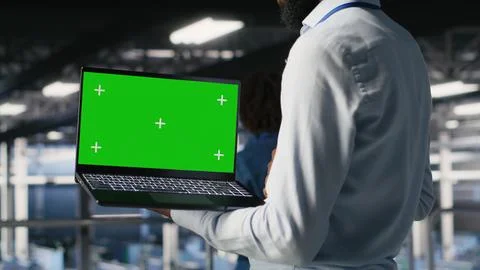 Close up of engineer on data center using green screen laptop Stock Photos