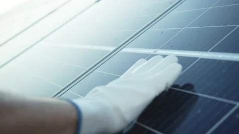 Close-up of engineer hand touches the solar panel battery. Industrial workman Stock Footage 135359962