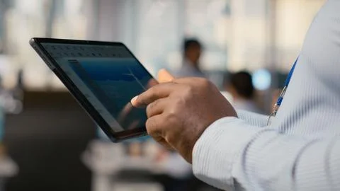 Close up of engineer in office using tablet to work on wind turbine CAD design Stock Photos