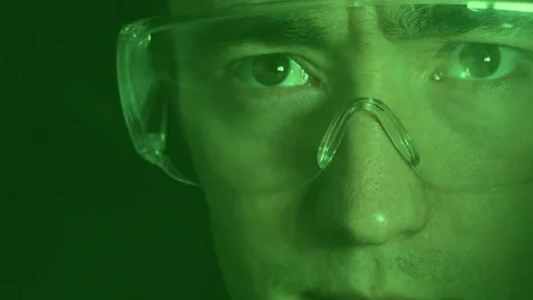 Close-up of the engineer of optical systems. Flicker and motion of particles. Stock Footage 82726115