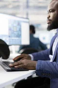 Close up of engineer optimizing PCB production with PC in research office Stock Photos