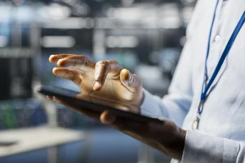 Close up of engineer in server room doing AI deep learning automatization 스톡 사진