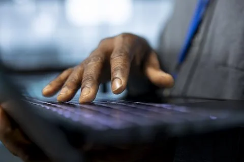 Close up of engineer in server room typing on laptop keyboard 스톡 사진