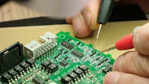 Close-up of the engineer testing the printed circuit board Stock Footage 293763771