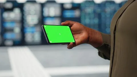 Close up of engineer using app on mockup phone to do server hub checkup Stock Photos