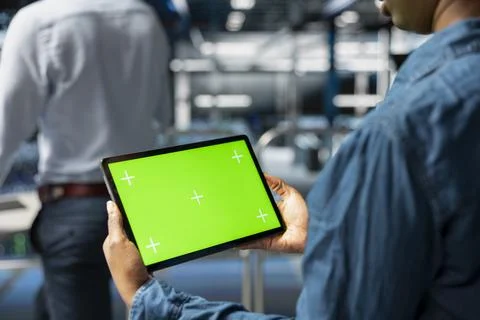 Close up of engineer using green screen mockup tablet in data center Stock Photos