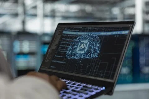 Close up of engineer using laptop in data center used for AI workloads 写真素材