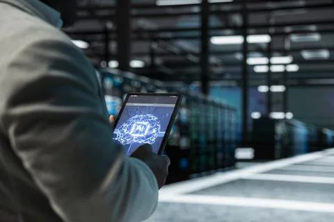 Close up of engineer using tablet in AI data center Foto stock
