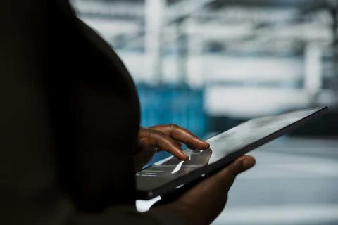 Close up of engineer using tablet in data center to track metrics Stock Photos