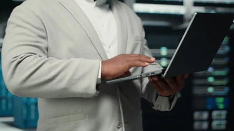 Close up of engineer walking in data center workplace, checking gear Stock Footage 311962928