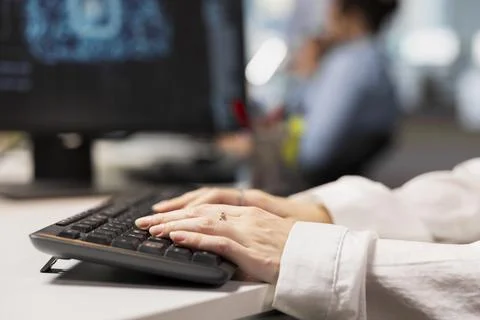 Close up of engineer writing code snippets in modern workplace Foto stock