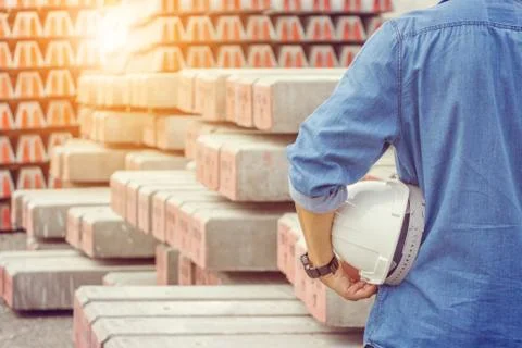 Close up of engineering man in blue jean with white helmet in hand 스톡 사진