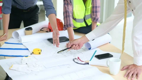 Close up engineering people are analytics construction plans with blueprint i Stock Footage 138041350