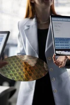 Close up of engineering team assessing semiconductor substrates quality Stock Photos