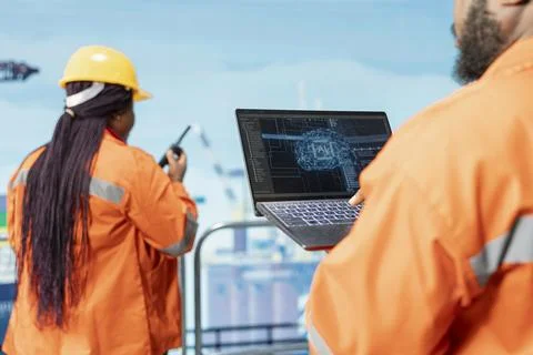 Close up of engineering team on offshore platform using artificial intelligence Stock Photos