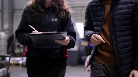 Close-up of engineers doing paperwork in a cnc modern factory Stock Footage 261224143