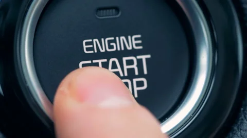 Close up of engine's start and stop button getting switched on and off Stock Footage 101193659