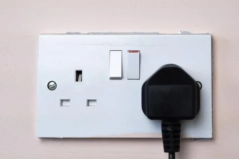 Close up of english socket in the wall Stock Photos