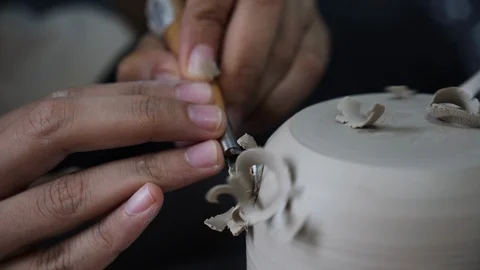 Close up of engraving a pottery flower pot on spinning table, Malaysia Stock Footage 146564550