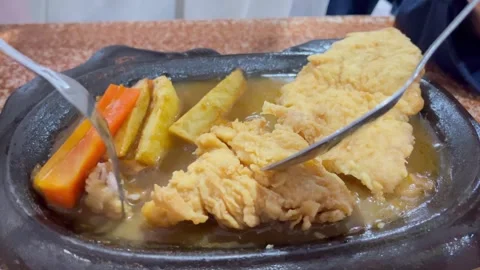 Close up enjoying chicken steak at a restaurant Stock Footage 328529237