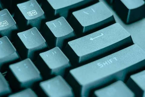 Close-up of the Enter and Shift keys on a black computer keyboard Stock Photos