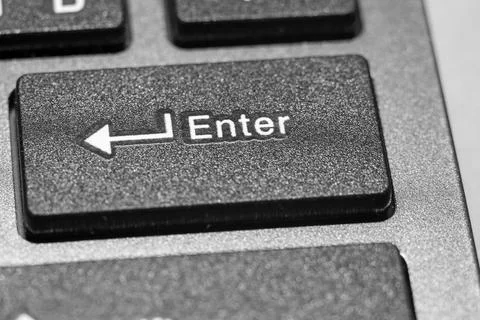 Close-up of the Enter key on a black computer keyboard Stock Photos