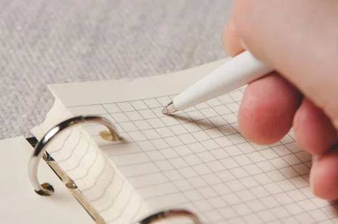Close-up of a entries in notepad. Notebook with pages in a cell Stock Photos