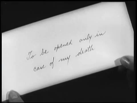 Close-up of envelope with instructions to be opened upon death Stock Footage 260256066