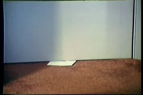 Close-up of envelope retrieved from under door Stock-Footage 11354345