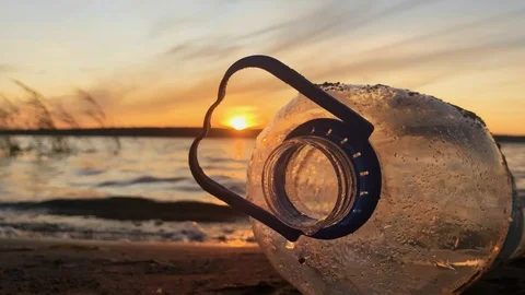 Close up. Environmental problem. Polluted beach. Bottle of plastic on the beach 스톡 동영상 114712865