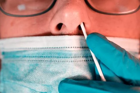 Close-up of epidemiologist taking PCR test of a patient during COIVD-19 outbreak Stock Photos