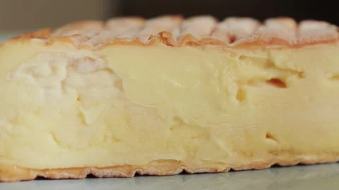 Close up of Epoisses cheese cut open, showing its soft creamy interior and Stock Footage 331781552