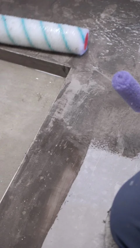 Close up of epoxy floor coating being rolled Stock Footage 325539198
