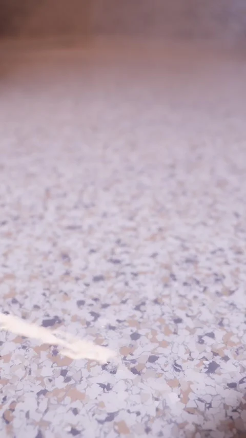 Close up of epoxy floor with decorative flakes vertical video Stock Footage 320921492