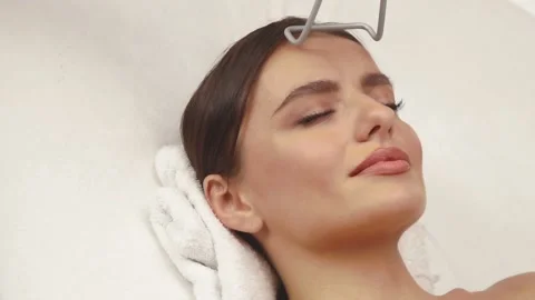 Close-up of erbium laser working on pretty woman face Stock Footage 143163498