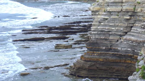 Close-up on eroded cliffs of Sainte-Barbe in Saint-Jean-de-Luz, France Stock Footage 253588318