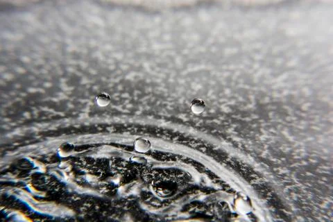 Close up of erupting drops Stock Photos