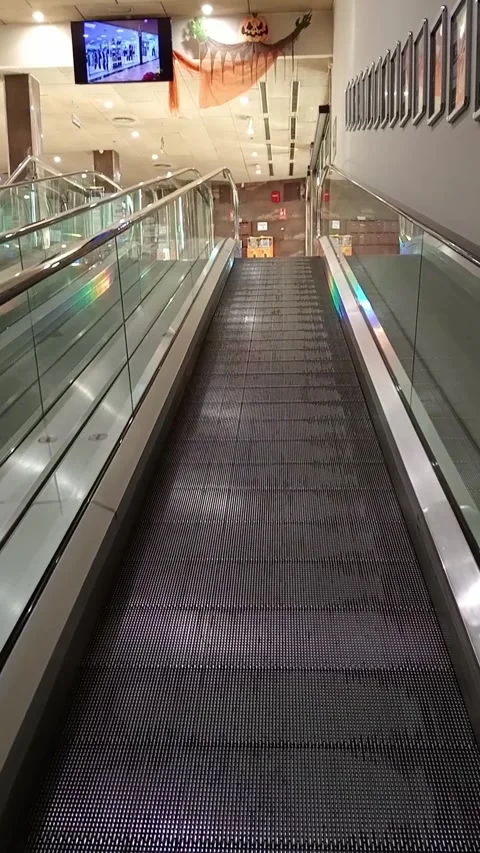 Close-up of an escalator ride inside a shopping mall in the Mallorcan town .. Stock Footage 288513199