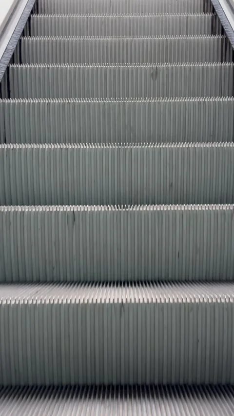 Close Up of Escalator Steps Moving Upward, Progress and Upward Movement Concept. Stock Footage 343759034